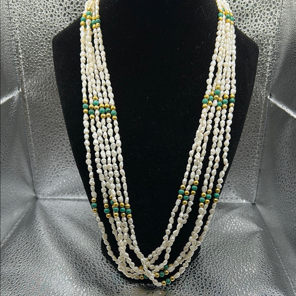 Beautiful multi-strand seed pearls with green and gold accent beads